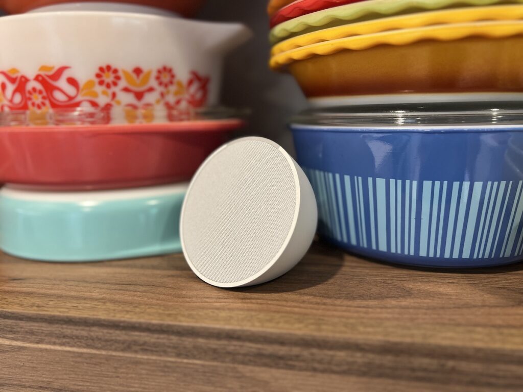 amazon echo pop next to casserole bowls