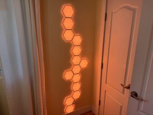 Linkind smart hexagon panels displayed on a wall.